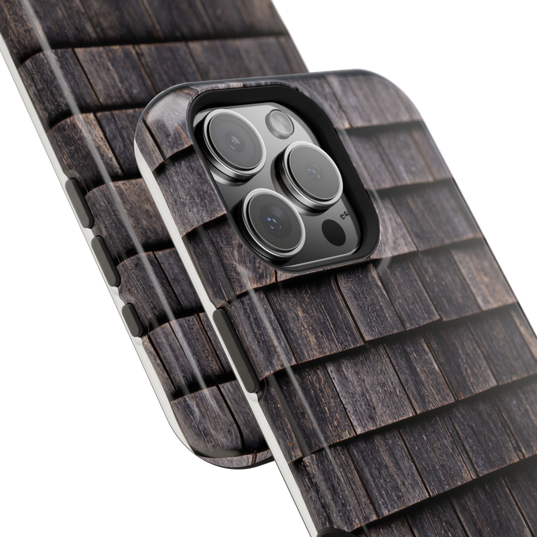 Close-up of a phone case with camera lens design on a white background