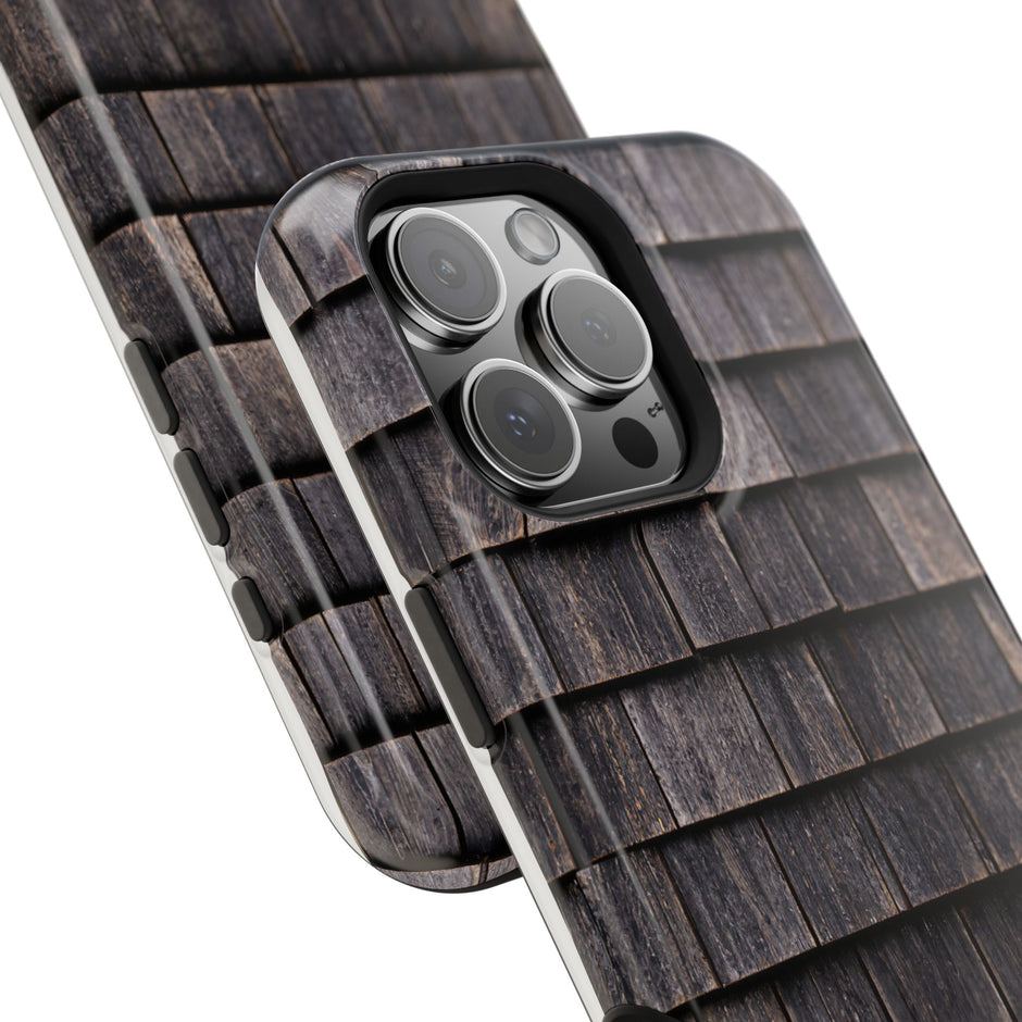 Close-up of a phone case with camera lens design on a white background