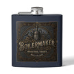 A matte navy blue flask with a silver screw cap and side spout, featuring a large embossed vintage-style steampunk label on the front with the word 'BOILERMAKER' and decorative gears, tools, and text.