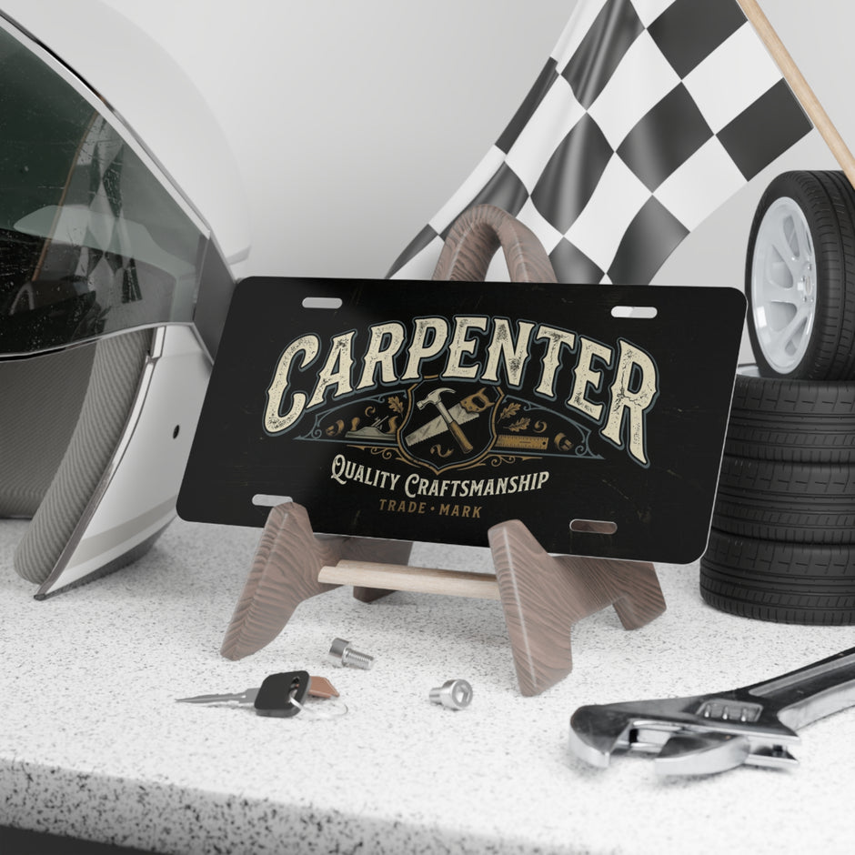 Black license plate with 'Carpenter' design on a stand, surrounded by automotive items.
