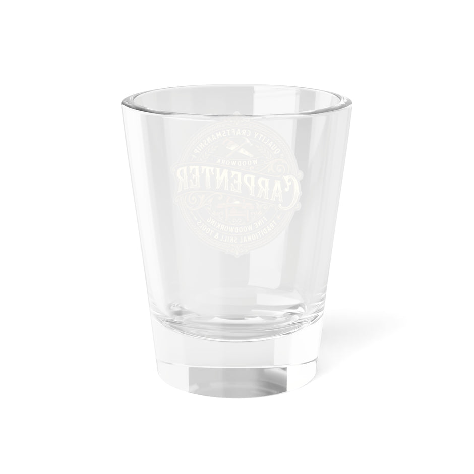 Back side of clear shot glass with branding on front side a white background