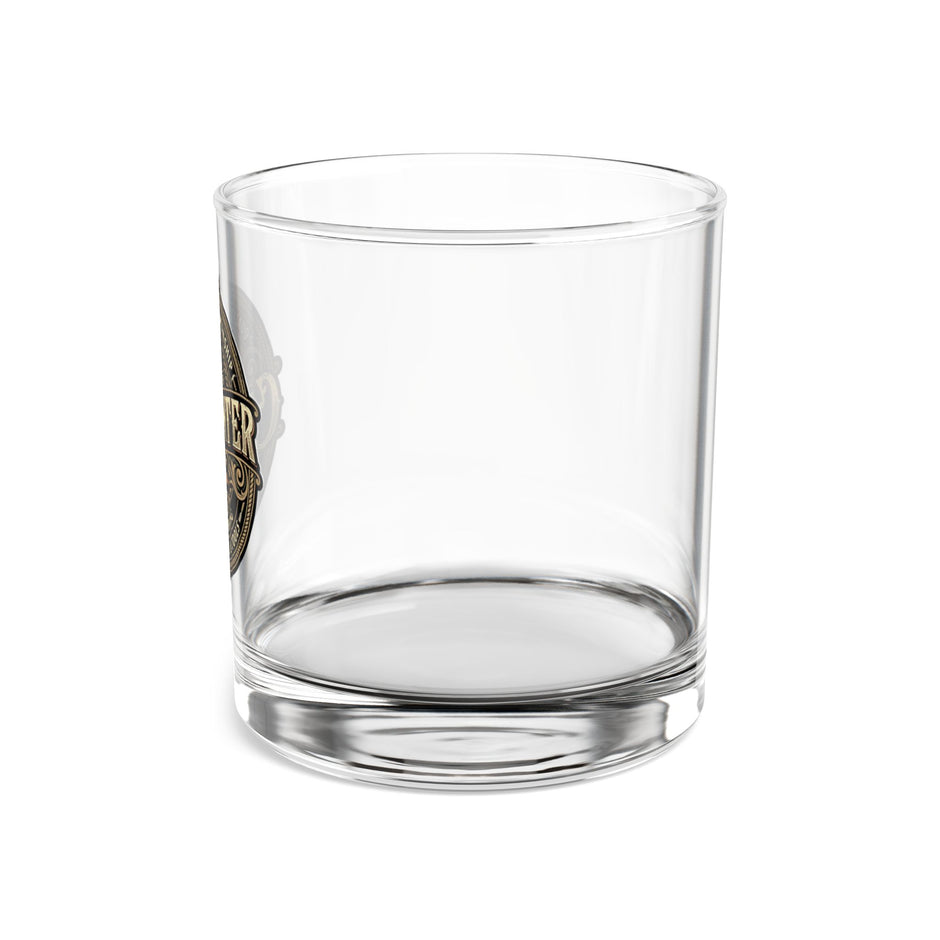 Clear glass tumbler with a logo on a white background