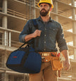 Worker carrying duffel bag with 