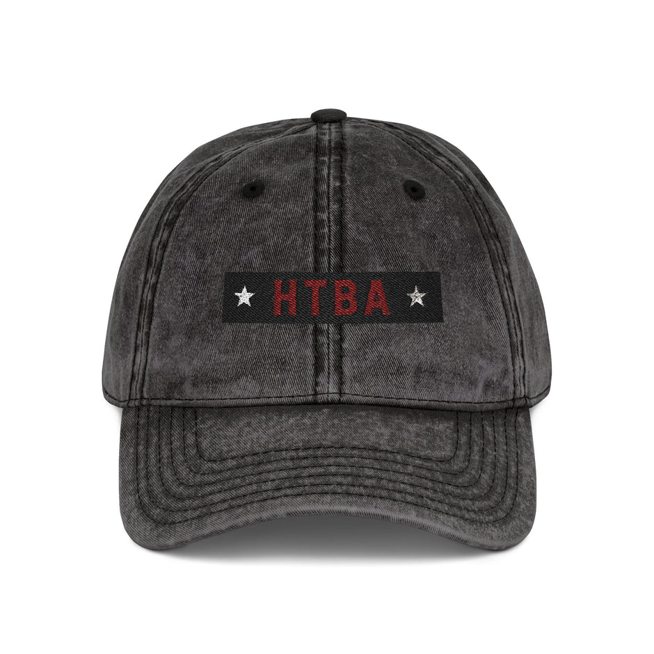 Black distressed cap with 'HTBA' logo on a white background