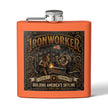 An orange metal flask with a silver screw-top lid and side spout, featuring a large vintage-style 'Ironworker' graphic on the front with an illustration of welders and the text 'Building America's Skyline Since 1901'.