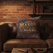 Decorative pillow with brick pattern and 'Mason' text on a white background