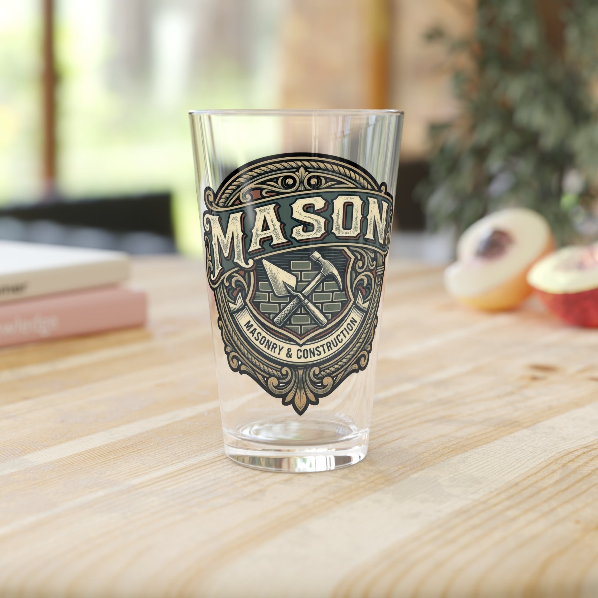 Clear glass with 'MASON' logo on a wooden surface