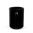 Black mug with colorful text on a white background