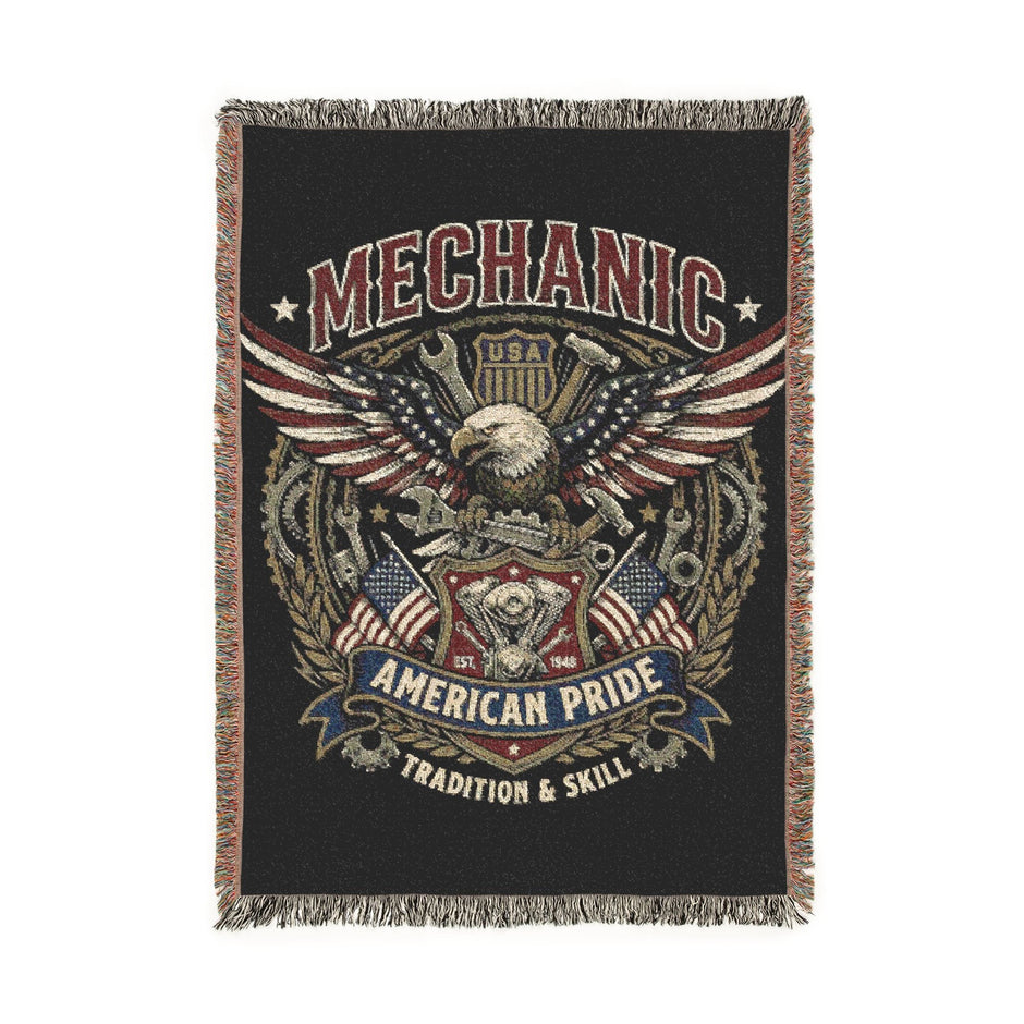 Woven blanket with mechanical design and text on a black background