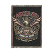 Woven blanket with mechanical design and text on a black background
