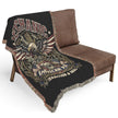 Mechanic-themed blanket draped over a brown chair on a white background