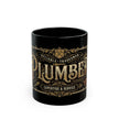 Black mug with gold decorative text on a white background