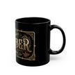 Black mug with gold and white text and design on a white background