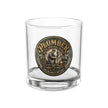Clear glass tumbler with a 'Plumber' medallion on a white background
