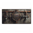 A rectangular Desk Mat featuring a vintage-style copper and dark metal plumbing fixture design with a central circular emblem reading 'Plumber's That Built America,' shown against a plain white background.