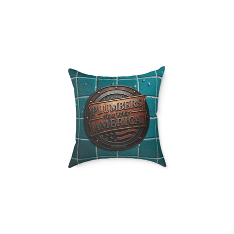 Decorative pillow with 'Plumbers That Build America' logo on a white background