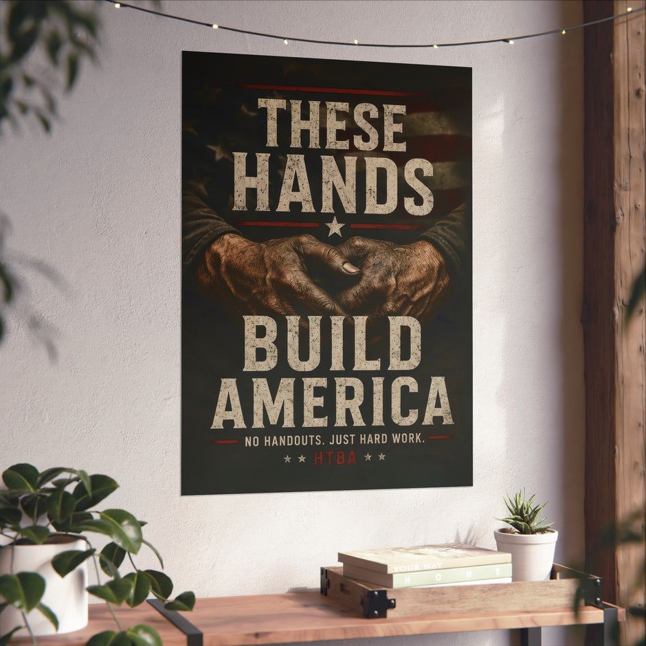 Poster with 'These Hands Build America' text and graphic of clasped hands on a wall above a desk.