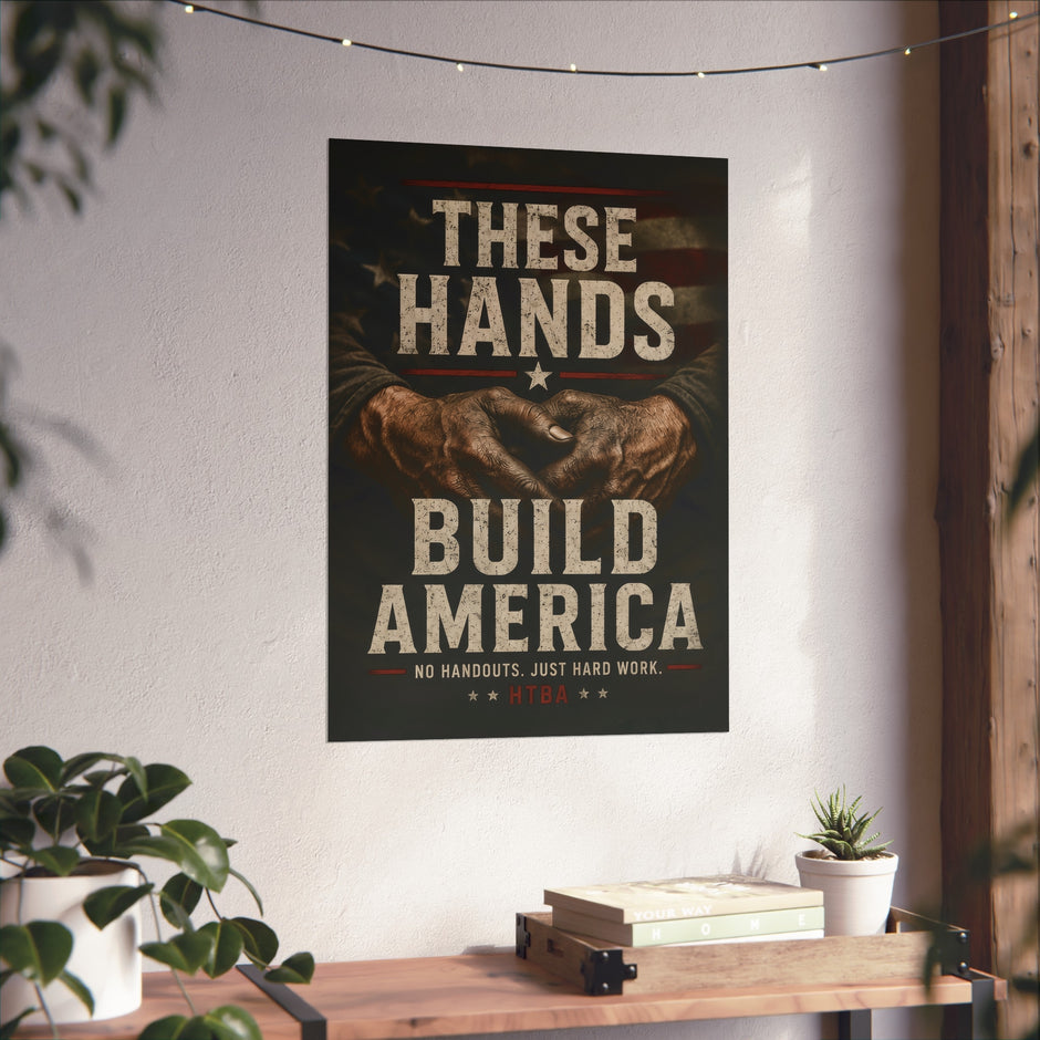 Poster with 'These Hands Build America' text on a wall above a wooden shelf with books and plants.