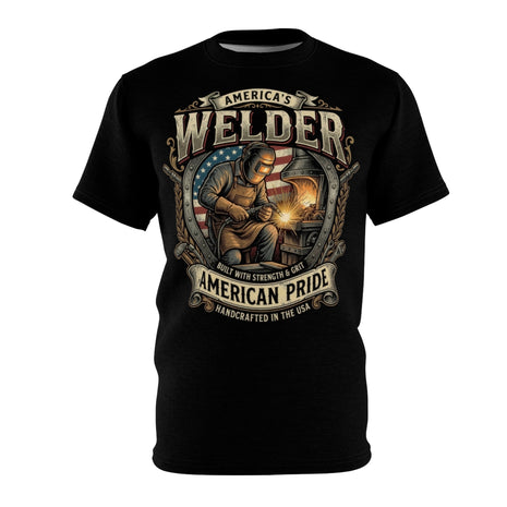 A black short-sleeve crewneck t-shirt featuring a large graphic print on the front. The graphic depicts a welder working in front of an American flag, with sparks, and text reading 'AMERICA'S WELDER', 'AMERICAN PRIDE', and 'HANDCRAFTED IN THE USA'.