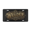 A novelty license plate with a black background and an ornate gold vintage-style emblem that reads 'Welder' with 'Est. 1923' and 'Metal Fabricator & Artisan' text.