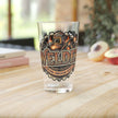 Clear glass with 'Welder' design on a wooden surface