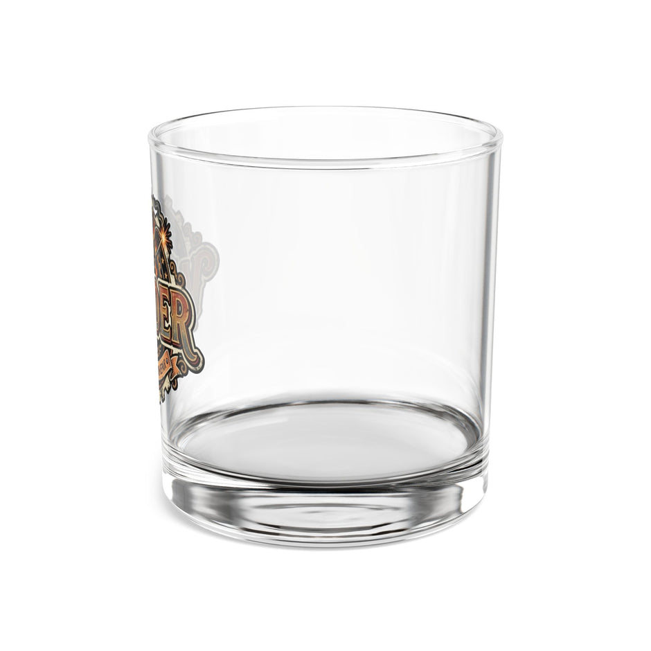 Clear glass tumbler with floral design on a white background
