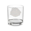 A clear glass rocks tumbler with a frosted gray circular logo on the front, set against a plain white background.