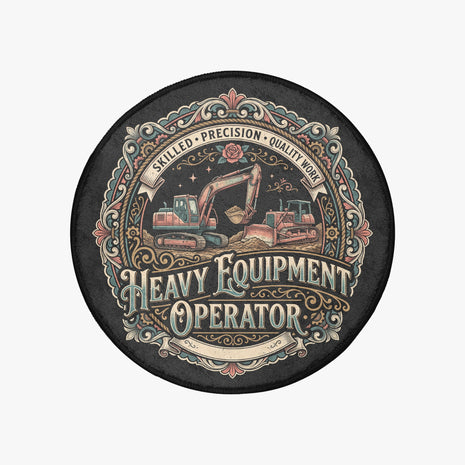 A circular black coaster or mat featuring a vintage-style illustrated graphic of heavy machinery, including an excavator and a bulldozer, with ornate decorative borders and the text 'HEAVY EQUIPMENT OPERATOR' and 'SKILLED • PRECISION • QUALITY WORK'.