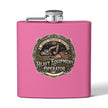 A bright pink rectangular flask with a silver screw cap and side spout, featuring a large vintage-style circular graphic on the front that reads 'Heavy Equipment Operator' with construction equipment artwork. Women in the Trades