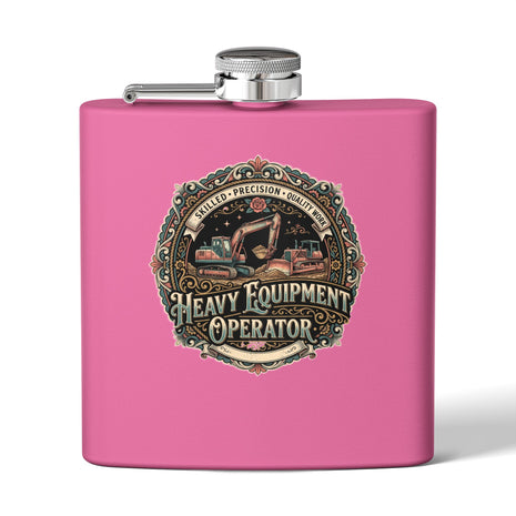 A bright pink rectangular flask with a silver screw cap and side spout, featuring a large vintage-style circular graphic on the front that reads 'Heavy Equipment Operator' with construction equipment artwork. Women in the Trades